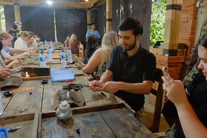 Photos of tourists taking a silversmithing course in bali