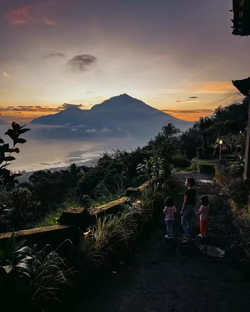 A beautiful sunrise at Lake Batur where the sun appears on the eastern horizon. 