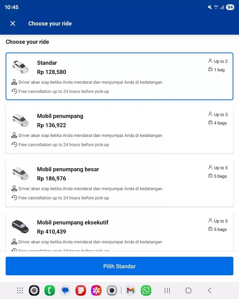 "Screenshot of Booking.com transfer options answering How Much is a Taxi from Bali Airport to Kuta with Standard car Rp 128,580"