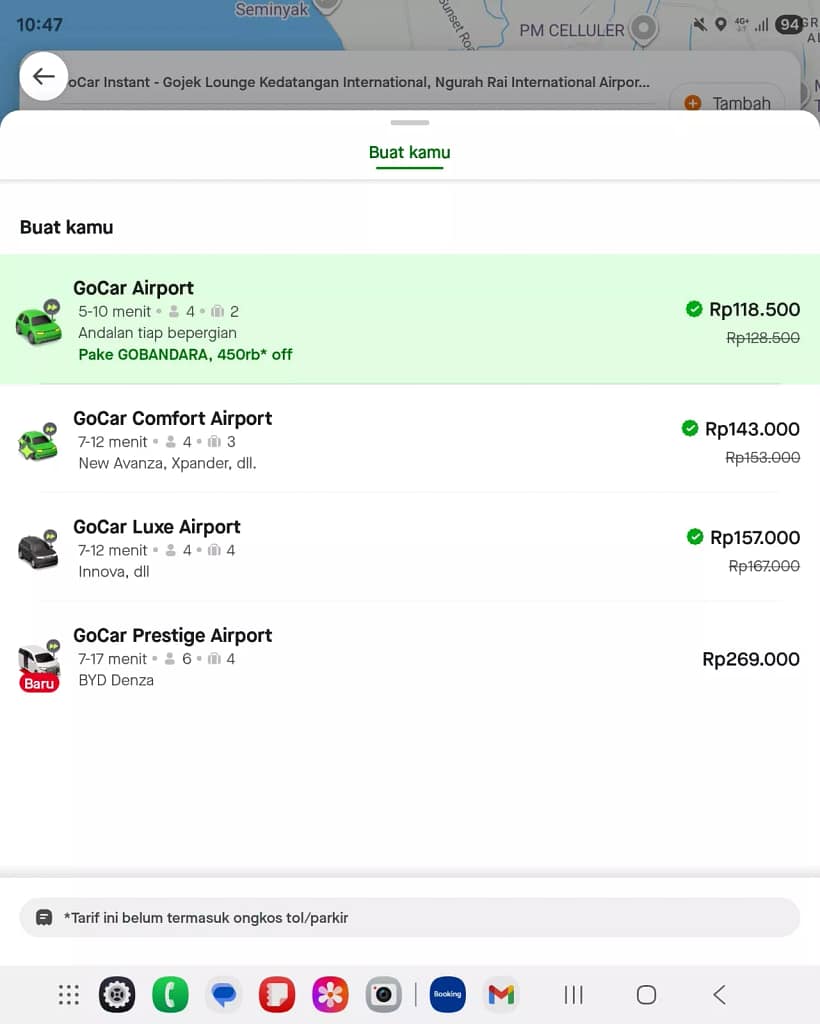 "Price comparison screenshot answering How Much is a Taxi from Bali Airport to Kuta on ride-hailing apps Gojek and Grab"