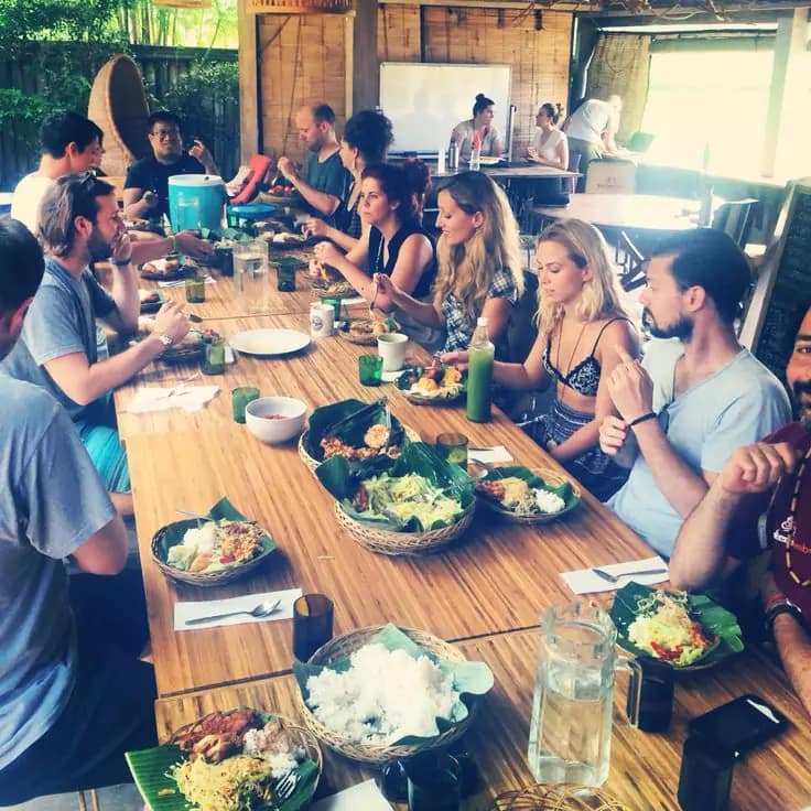 tourist group photo in bali eating at a warung - Bali first 12 hours