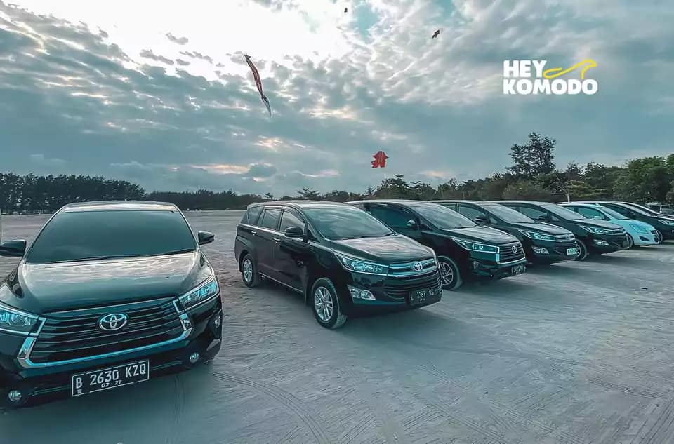 photo of several cars in the parking lot near Bali airport